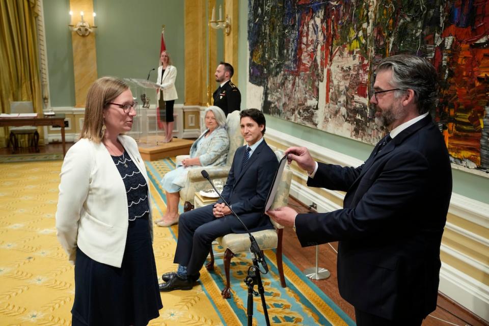 Prime Minister Justin Trudeau looks on as Leader of the Government in the House of Commons Karina Gould takes the oath during a cabinet swearing-in ceremony at Rideau Hall in Ottawa on Wednesday, July 26, 2023. 