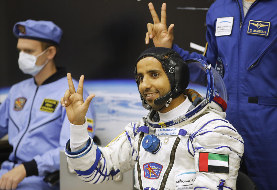 United Arab Emirates astronaut Hazza Almansoori, member of the main crew of the expedition to the International Space Station (ISS), gestures prior the launch of Soyuz MS-15 space ship at the Russian leased Baikonur cosmodrome, Kazakhstan, Wednesday, Sept. 25, 2019. (AP Photo/Dmitri Lovetsky)
