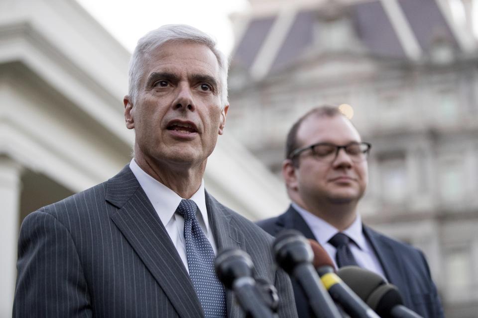 FILE - Club for Growth president David McIntosh, left, accompanied by FreedomWorks President Adam Brandon, right, speaks to members of the media outside the West Wing of the White House, March 8, 2017, in Washington. McIntosh said Tuesday, Feb. 7, 2023, that the group has invited a half dozen potential Republican candidates to its donor summit in Florida next month, but former President Donald Trump — the only declared major candidate in the race so far — is not among them. (AP Photo/Andrew Harnik, File)