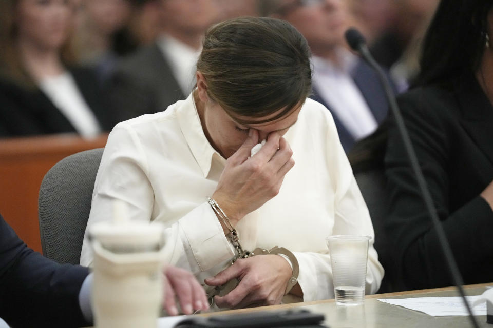 Kouri Richins, a Utah mother of three who authorities say fatally poisoned her husband then wrote a children's book about grieving, cries during a bail hearing Monday, June 12, 2023, in Park City, Utah. A judge ruled to keep her in custody for the duration of her trial. (AP Photo/Rick Bowmer, Pool)