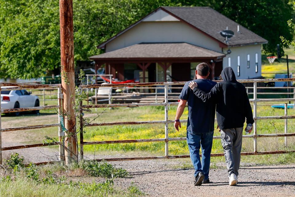 Justin and Haydon Webster, the father and brother of Ivy Webster, visit the site where Ivy’s body was found in Henryetta Okla., on May 2, 2023.