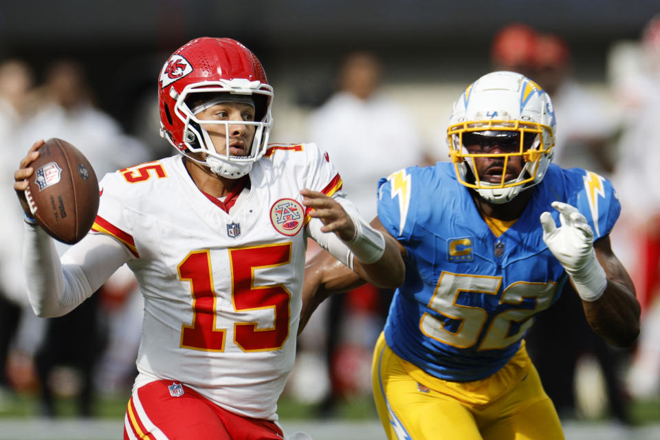 INGLEWOOD, CALIFORNIA – SEPTEMBER 29: Patrick Mahomes #15 of the Kansas City Chiefs looks to throw the ball as Khalil Mack #52 of the Los Angeles Chargers applies pressure during the third quarter at SoFi Stadium on September 29, 2024 in Inglewood, California. (Photo by Kevork Djansezian/Getty Images)