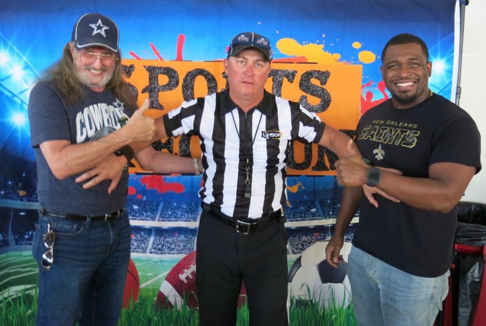 Friendly rivalry: Dallas Cowboys fan John Smith (left) and New Orleans Saints fan Carl Darrius Murphy (right) face off while referee Richard Murphy (center) keeps the peace at the Krewe of Elders coronation in August 2023.