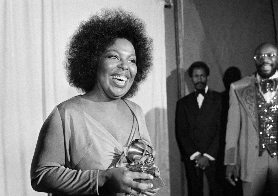 In this March 4, 1974 file photo, Roberta Flack holds the Grammy award for her record, "Killing Me Softly With His Song" as singer Isaac Hayes, right, looks on at the Grammy Awards in Los Angeles. A representative for Flack has announced that the legendary singer has ALS, commonly known as Lou Gehrig’s disease, and can no longer sing.