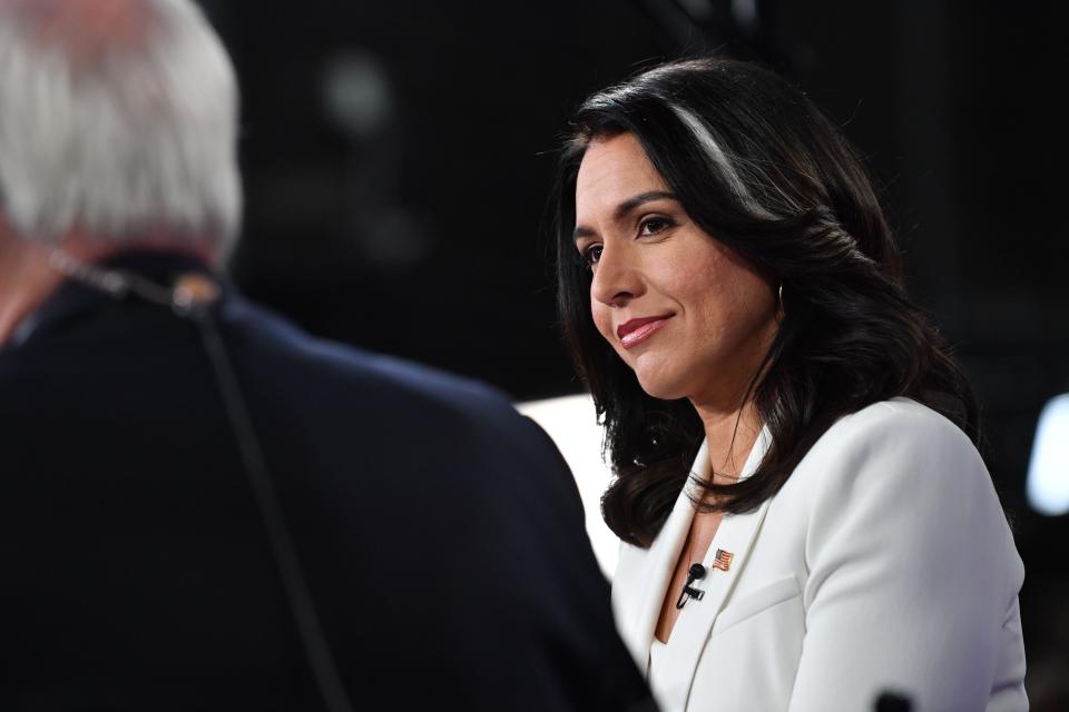 Democratic presidential hopeful Representative for Hawaii Tulsi Gabbard speaks to the press in the Spin Room following the fifth Democratic primary debate of the 2020 presidential campaign season co-hosted by MSNBC and The Washington Post at Tyler Perry Studios in Atlanta, Georgia on November 20, 2019. (Photo by Nicholas Kamm / AFP) (Photo by NICHOLAS KAMM/AFP via Getty Images) ORG XMIT: Fifth Dem ORIG FILE ID: AFP_1MG0GN