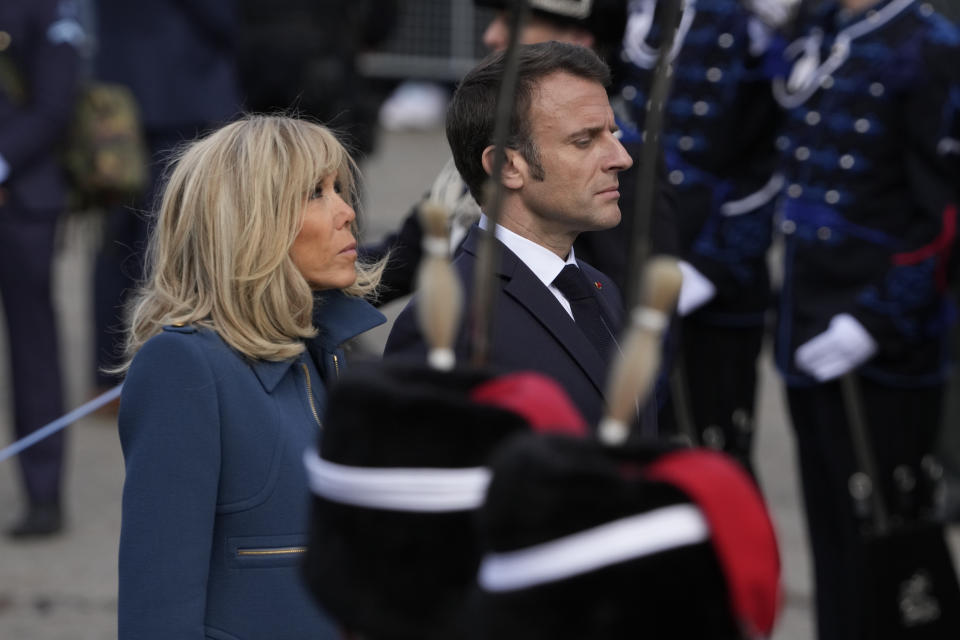 French President Emmanuel Macron and his wife Brigitte Macron attend a wreath laying ceremony in Amsterdam, Netherlands, Tuesday, April 11, 2023. French President Emmanuel Macron begins a two-day state visit to the Netherlands on Tuesday and is making a speech on his vision for the future of Europe. (AP Photo/Peter Dejong)