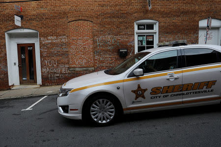 A local Sheriff patrols past the site where Heather Heyer was killed during the 2017 white-nationalist rally in Charlottesville, Virginia, U.S., August 1, 2018. REUTERS/Brian Snyder