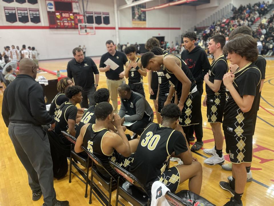 Rush-Henrietta coach Calvin Betts talks to his team during the Section V Class AAA quarterfinals on Friday, Feb. 23, 2024 at Roberts Wesleyan University. University Prep beat Rush-Henrietta 58-56 on Alex Webb's shot with 1.5 seconds left.