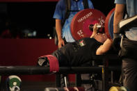 FILE - In this Aug. 26, 2021, file photo, Jordan's Omar Sami Hamadeh Qarada prepares to lift during men's 49kg powerlifting final at the Tokyo 2020 Paralympic Games in Tokyo, Japan. Qarada won a gold medal in the event. There are 4,403 Paralympic athletes competing in Tokyo, each with unique differences that have to be classified. Lines have to be draw, in the quest for fairness, to group similar impairments, or impairments that yield similar results. (AP Photo/Kiichiro Sato, File)