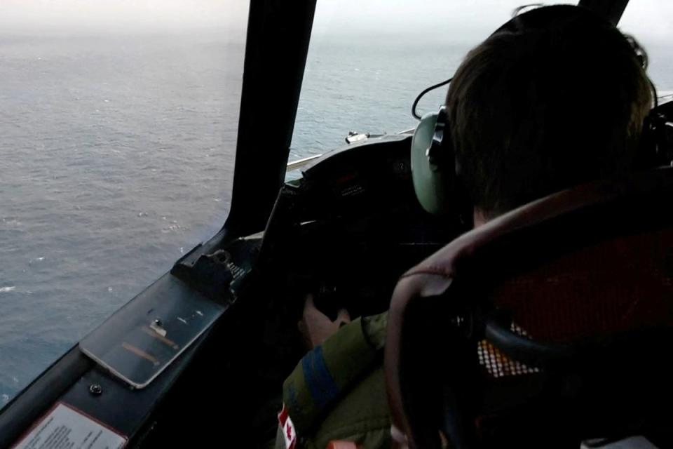 The pilot of a Royal Canadian Air Force CP-140 Aurora maritime surveillance aircraft of 14 Wing flies a search pattern for the missing OceanGate submersible, which had been carrying five people to explore the wreck of the sunken SS Titanic, in the Atlantic Ocean off Newfoundland, Canada (via REUTERS)