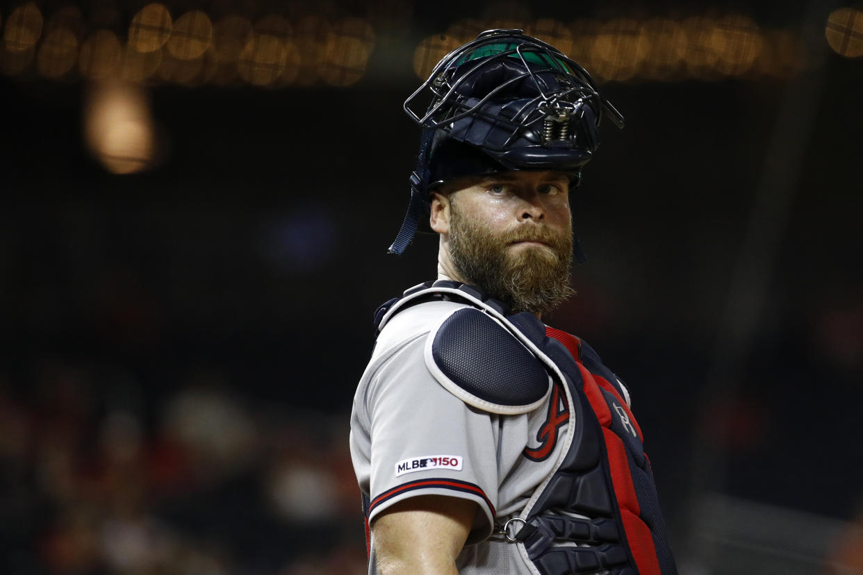 Atlanta Braves catcher Brian McCann stands behind home plate during a baseball game against the Washington Nationals, Tuesday, July 30, 2019, in Washington. (AP Photo/Patrick Semansky)