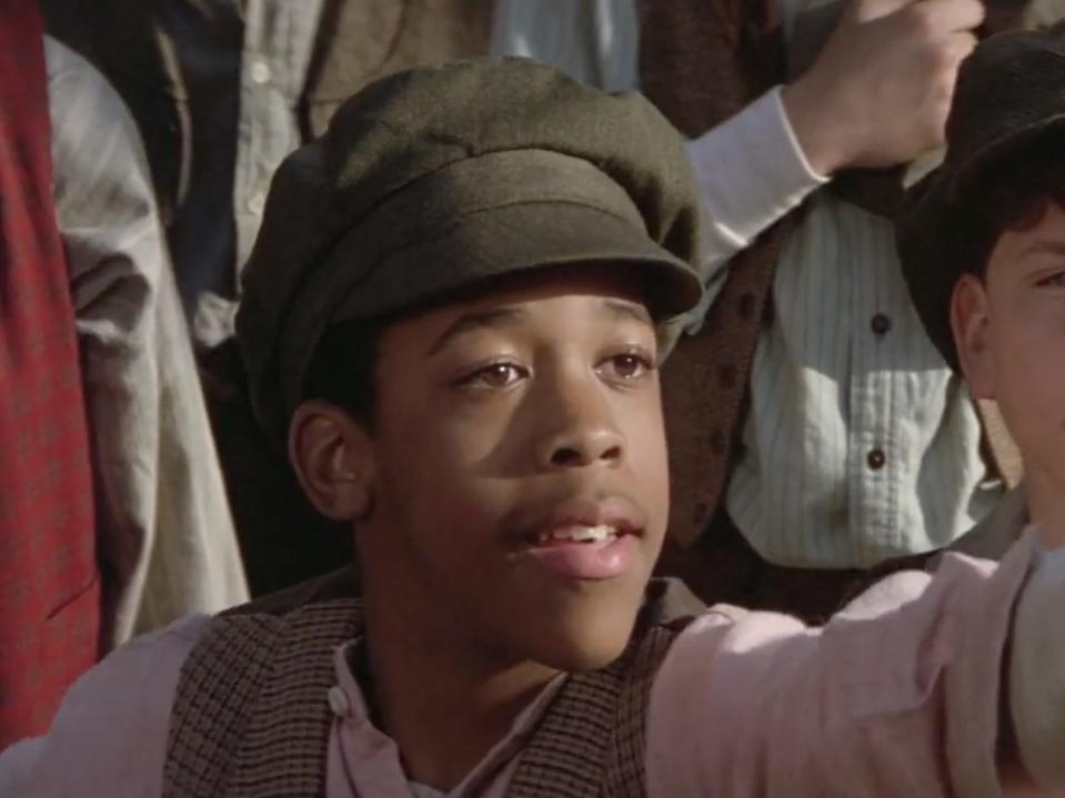 boots reaching for bread in newsies movie