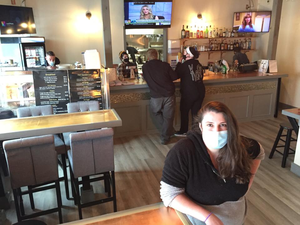 Alex Morano, owner of The Food Bar, stands April 21, 2021 in the dining room of the restaurant in Essex Junction.
