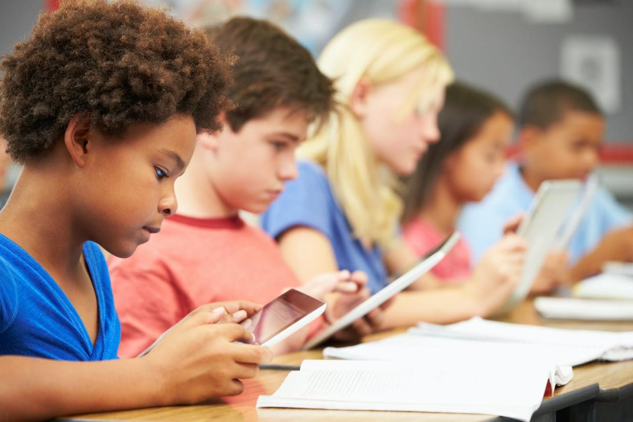 <span class="caption">America's public schools were meant to bring together children from all walks of life.</span> <span class="attribution"><a class="link " href="https://www.shutterstock.com/image-photo/pupils-class-using-digital-tablet-141206683?src=WoG6QCrmGh7bBfJiX06xgA-4-49" rel="nofollow noopener" target="_blank" data-ylk="slk:Monkey Business Images/www.shutterstock.com;elm:context_link;itc:0;sec:content-canvas">Monkey Business Images/www.shutterstock.com</a></span>