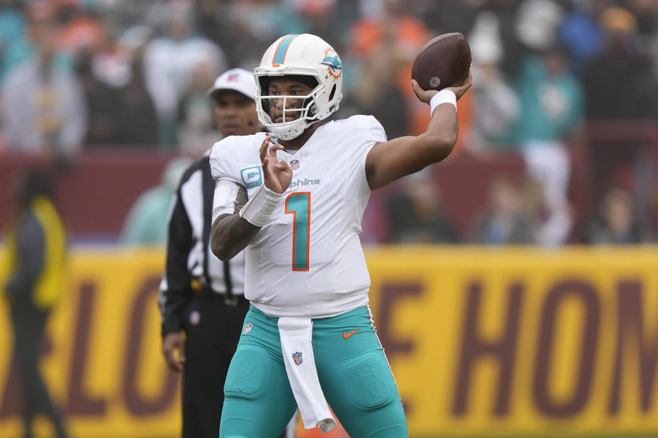 Miami Dolphins quarterback Tua Tagovailoa (1) passes against the Washington Commanders during the first half of an NFL football game Sunday, Dec. 3, 2023, in Landover, Md. (AP Photo/Mark Schiefelbein)