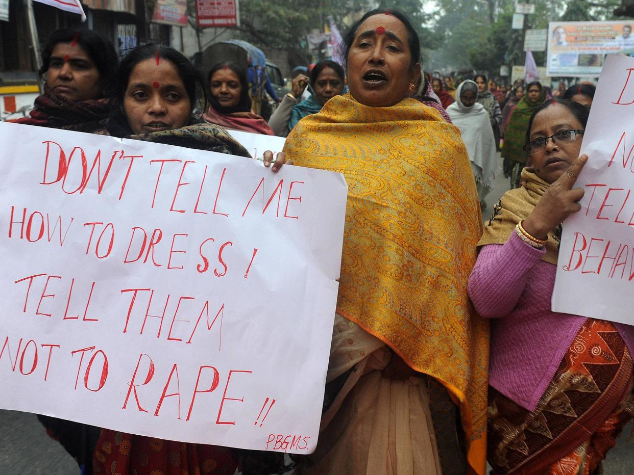 Representative image. Indian women activists hold placards during a protest against the gang rape and murder of a student in the Indian capital New Delhi (Getty)