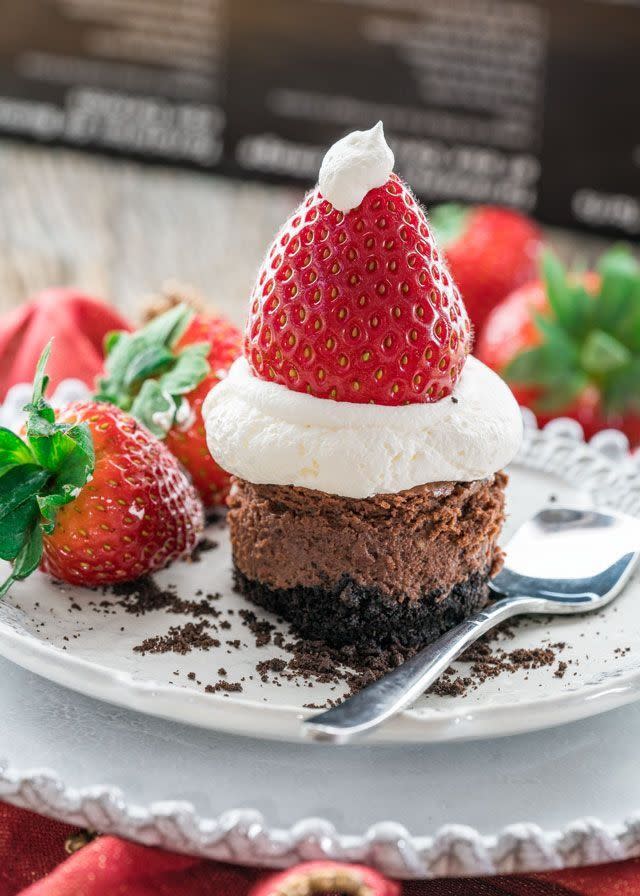 <p>Topped with a dollop of whipped cream and strawberries, these chocolate cheesecakes are almost too cute to eat. Operative word: almost.</p><p><strong>Get the recipe for <a href="https://www.jocooks.com/recipes/chocolate-cheesecake-santa-hats/" rel="nofollow noopener" target="_blank" data-ylk="slk:Chocolate Cheesecake Santa Hats;elm:context_link;itc:0;sec:content-canvas" class="link ">Chocolate Cheesecake Santa Hats</a> at Jo Cooks.</strong></p>