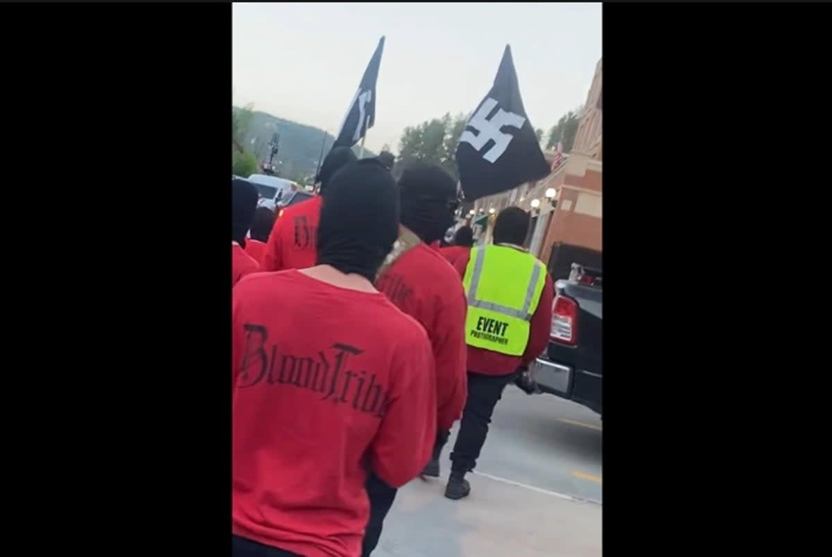 A neo-Nazi group displayed a Nazi flag on the steps of South Dakota’s state capitol as they held rallies in the state.  (Rich Sattgast/Facebook)