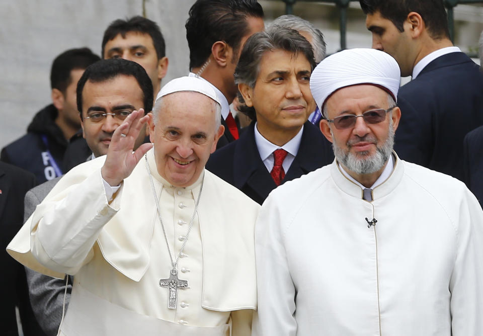 Pope Francis is welcomed by Mufti of Istanbul Rahmi Yaran outside Blue Mosque in Istanbul