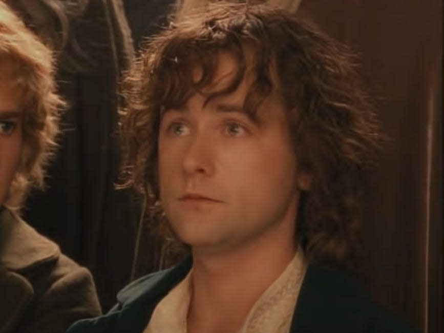 pippin wearing a blue jacket in lord of the rings