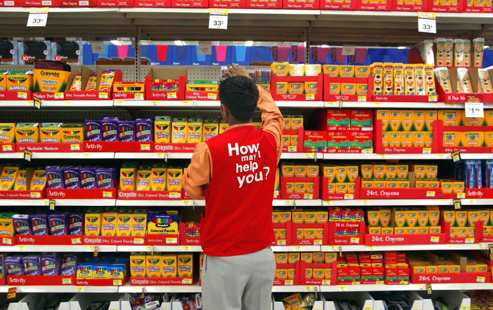 ROLLING MEADOWS, IL - JULY 26:  A sales associate arranges back-to-school items in a Wal-Mart store July 28, 2003 in Rolling Meadows, Illinois. Wal-Mart said that sales in the month of July at its U.S. stores that were open at least one year could top expectations. Warm weather has helped turnaround slower retail sales following the cooler weather of May and June.  (Photo by Tim Boyle/Getty Images)