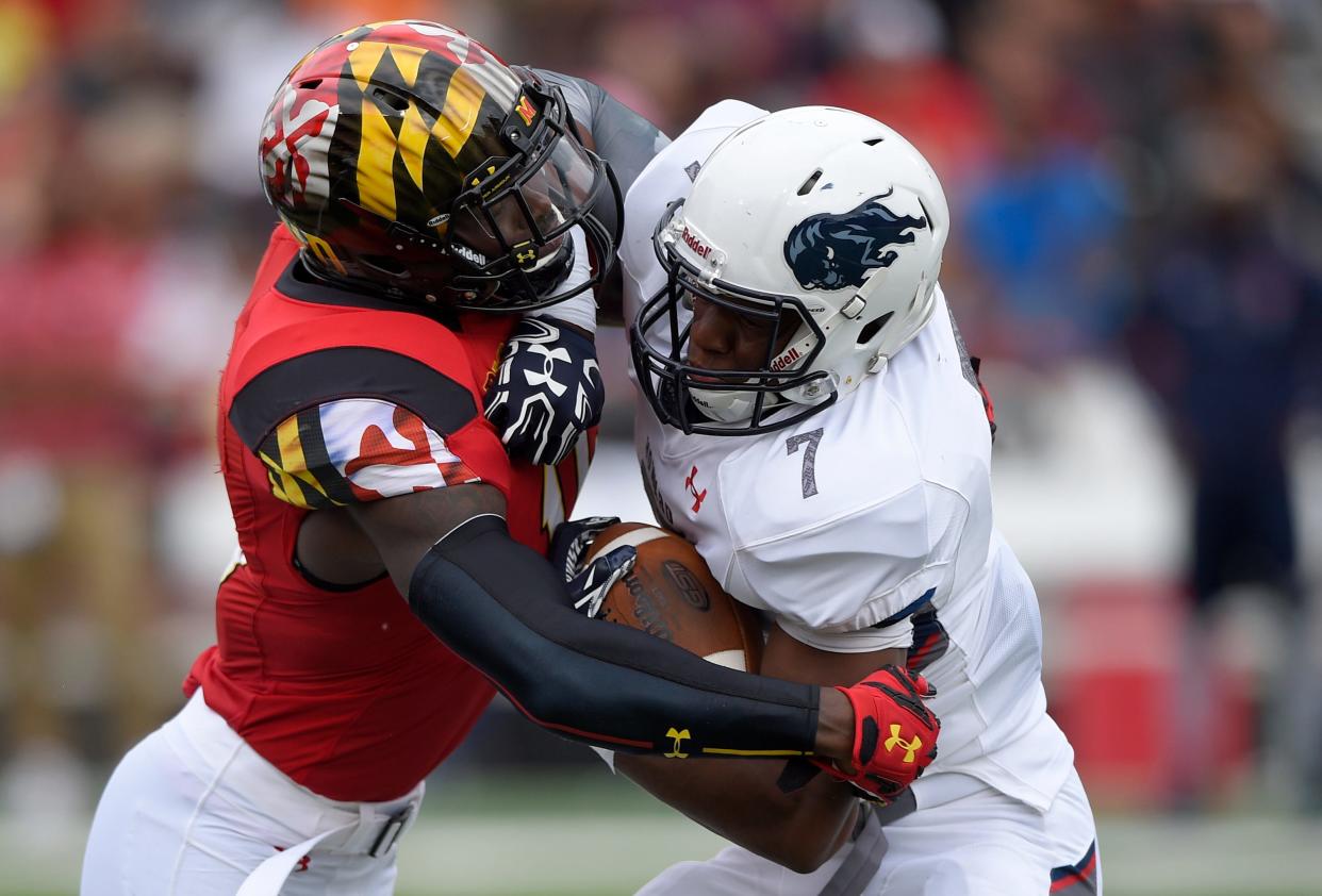 Maryland defensive lineman Melvin Keihn, left, tackles Howard running back Anthony Philyaw (7) during the first half of an NCAA college football game, Saturday, Sept. 3, 2016, in College Park, Md. (AP Photo/Nick Wass)