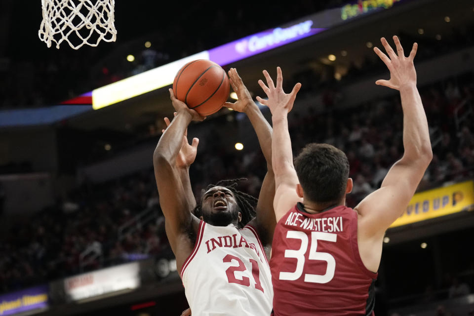 Indiana forward Mackenzie Mgbako (21) shoots over Harvard forward Luca Ace-Nasteski (35) in the second half of an NCAA college basketball game in Indianapolis, Sunday, Nov. 26, 2023. (AP Photo/AJ Mast)