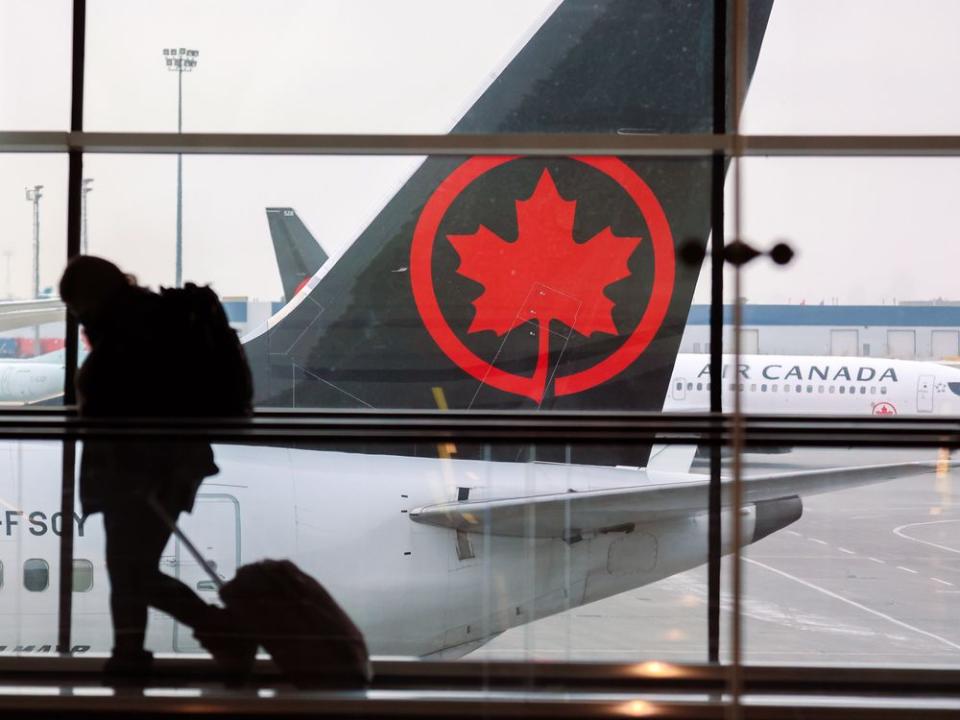  Air Canada reported a fourth-quarter profit of $184 million, up from $168 million a year earlier,Gavin Young/Postmedia