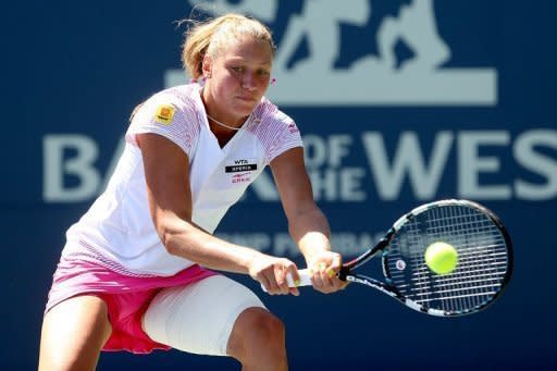 Yanina Wickmayer of Belgium returns a shot to Marion Bartoli of France at the Stanford University Taube Family Tennis Stadium in California. Wickmayer won 6-3, 6-2