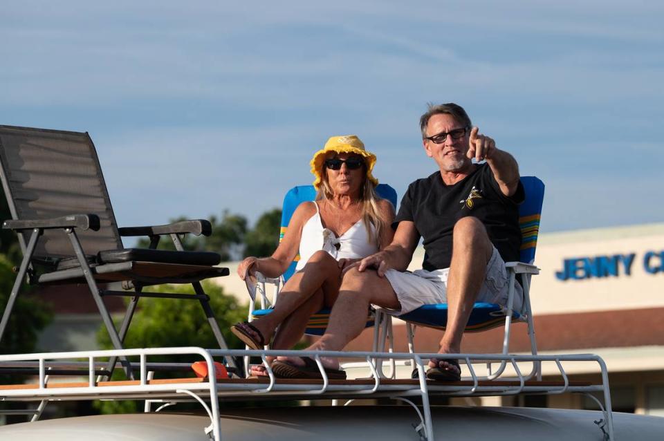 Scott Seward and Michele Downing sit atop a 1962 Volkswagen bus to watch the Graffiti Parade from McHenry Village shopping center in Modesto, Calif., Friday, June 9, 2023. Andy Alfaro/aalfaro@modbee.com