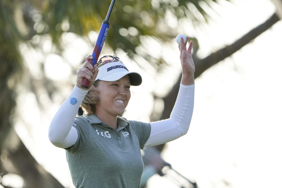 Brooke Henderson celebrates after sinking her final putt to win the LPGA Hilton Grand Vacations Tournament of Champions, Sunday, Jan. 22, 2023, in Orlando, Fla. (AP Photo/John Raoux)