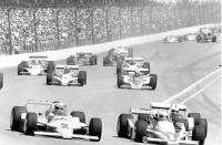 FILE - Al Unser (2), Tom Sneva (1) and Rick Mears (12) lead the field into the first turn of the first lap on the Indianopolis Motor Speedway Track at the 63rd annual Indianapolis 500 in Indianapolis, Ind., on May 27, 1979. Unser, one of only four drivers to win the Indianapolis 500 a record four times, died Thursday, Dec. 9, 2021, following years of health issues. He was 82. (AP Photo, File)