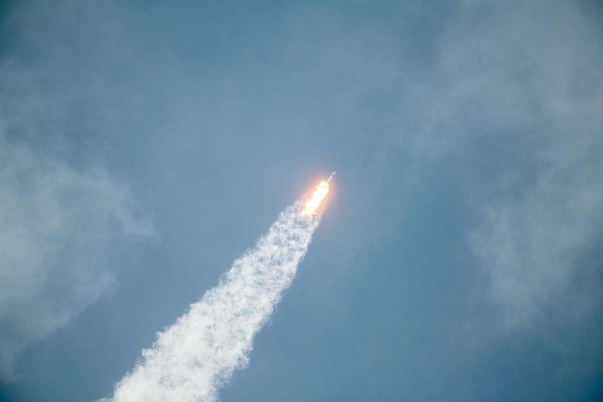 In this SpaceX handout image, a Falcon 9 rocket carrying the company's Crew Dragon spacecraft launches on the Demo-2 mission to the International Space Station with NASA astronauts Robert Behnken and Douglas Hurley onboard at Launch Complex 39A May 30, 2020, at the Kennedy Space Center, Cape Canaveral, Florida: SpaceX via Getty Images