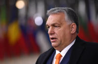 Hungary's Prime Minister Viktor Orban speaks as he arrives for an EU summit at the European Council building in Brussels, Thursday, Dec. 10, 2020. European Union leaders meet for a year-end summit that will address anything from climate, sanctions against Turkey to budget and virus recovery plans. Brexit will be discussed on the sidelines. (John Thys, Pool via AP)