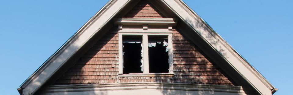 An abandoned home on 33rd Street in Milwaukee helps tell the story of a neighborhood's troubles.