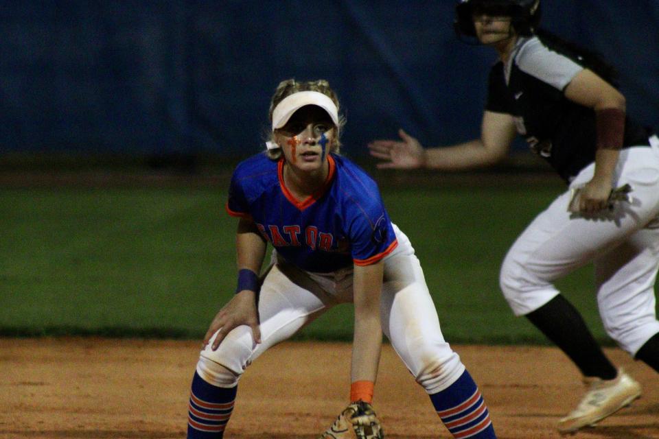 Palm Beach Gardens sophomore and first baseman Madison Quinn watches the Broncos' batter in the Gators' 10-0 win on Tuesday, Mar. 8, 2022.