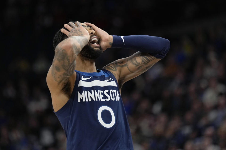 Minnesota Timberwolves guard D'Angelo Russell (0) reacts to a foul call during the second half of an NBA basketball game against the Sacramento Kings, Monday, Jan. 30, 2023, in Minneapolis. (AP Photo/Abbie Parr)