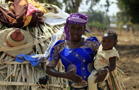 A wife of a Fulani herdsman is pictured with her baby in Zango, Zango-Kataf, Kaduna State, March 22, 2014. REUTERS /Afolabi sotunde