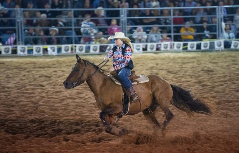 UW-River Falls sophomore Remi Elbert competes in barrel racing. After summer break, she loaded her trailer with her horse, Lily, along with bridles, brushes, saddles, grain, tack and feed, to return to campus.