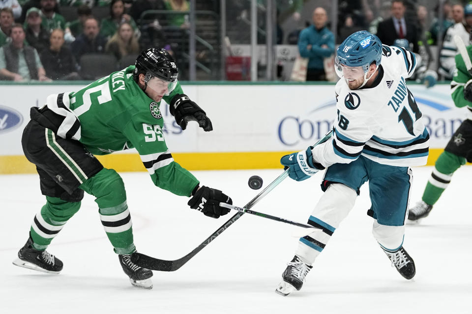 San Jose Sharks right wing Filip Zadina (18) has his shot broken up by Dallas Stars defenseman Thomas Harley (55) during the second period of an NHL hockey game in Dallas, Saturday, March 2, 2024. (AP Photo/Tony Gutierrez)