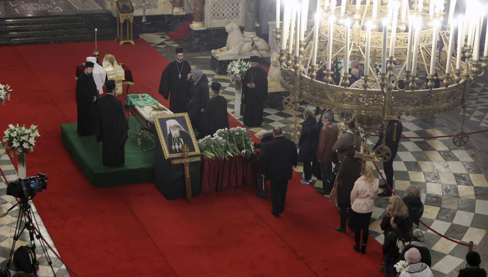 Bulgarian Orthodox believers pay their last respects to Bulgarian patriarch Neophyte at the Alexander Nevsky Cathedral in Sofia, Friday, March 15, 2024. National mourning was declared by the Bulgarian government on March 15 and 16 to honour Patriarch Neophyte of Bulgaria. Neophyte who was the first elected head of the Orthodox Church in the post-communist Balkan country, died at a hospital in Sofia on March 13. He was 78. . (AP Photo/Valentina Petrova)
