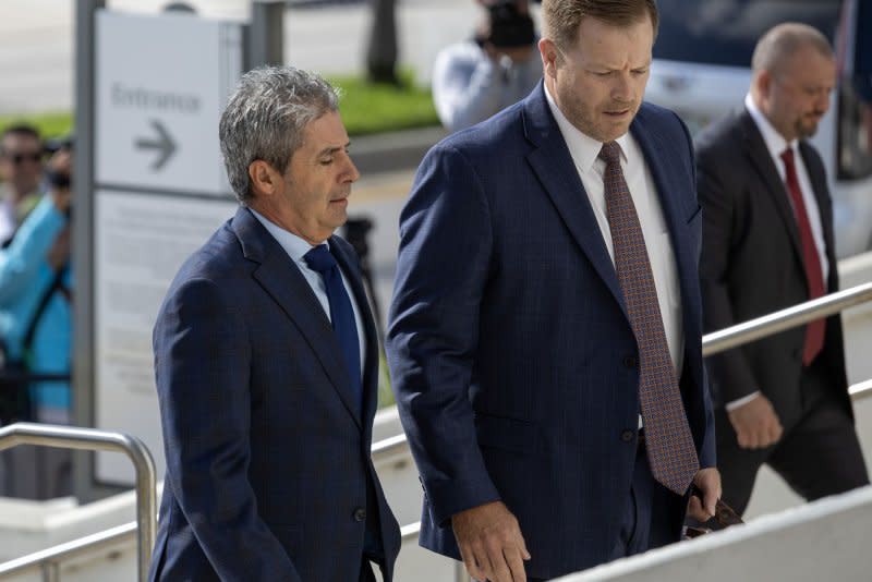 Carlos De Oliveira (L) makes his second appearance at the Alto Lee Adams Sr. U.S. federal courthouse in Fort Pierce, Fla., on Thursday. De Oliveira, the property manager at Trump's Mar-a-Lago resort, saw his arraignment delayed for a second time because he still has not retained a lawyer in Florida. Photo by Gary I Rothstein/UPI