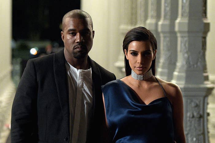Kanye and Kim, both looking serious, stand together at the 2014 LACMA Art + Film Gala