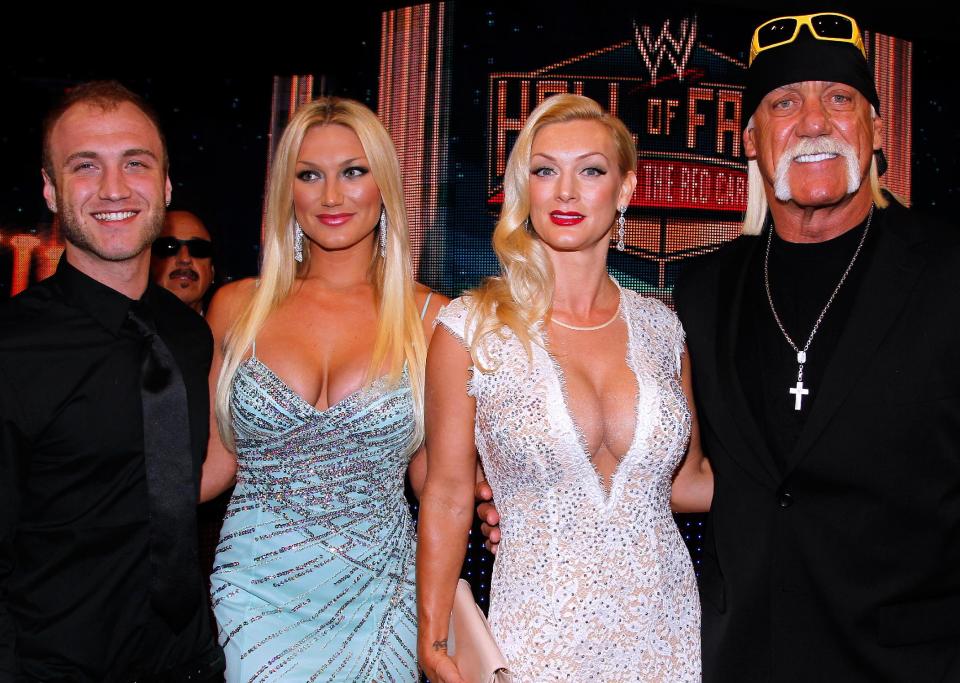 Hulk Hogan, right, Jennifer McDaniels, second right, Brooke Hogan, second from left, and Nick Hogan, left, are seen at the WWE Hall of Fame Induction at the Smoothie King Center in New Orleans on Saturday, April 5, 2014. (Jonathan Bachman/AP Images for WWE)