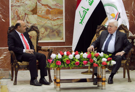 FILE PHOTO: Iraq President Fuad Masum (R) meets with Basra Governor Majid al-Nasrawi in Basra, southeast of Baghdad, Iraq February 23, 2015.REUTERS/Essam Al-Sudani/File Photo