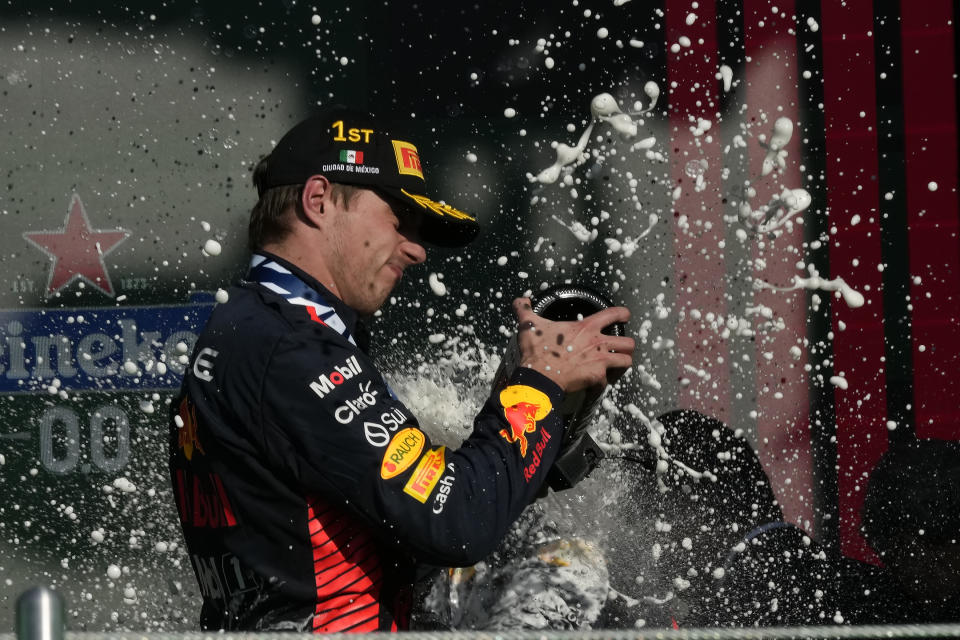 Red Bull driver Max Verstappen of the Netherlands celebrates on the podium after winning the Formula One Mexico Grand Prix auto race at the Hermanos Rodriguez racetrack in Mexico City, Sunday, Oct. 29, 2023. (AP Photo/Fernando Llano)