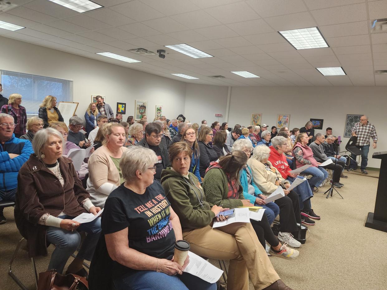 Community members fill the board room at the Manitowoc Public School District's office during a public meeting Oct. 10.