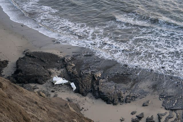 <p>Liu Guanguan/China News Service/VCG via Getty Images</p> Plane wreckage at Half Moon Bay