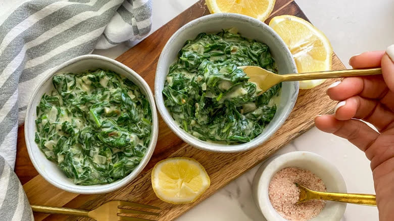 Two bowls of creamed spinach