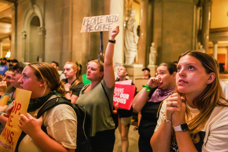 Mandatory Credit: Photo by Jeremy Hogan/SOPA Images/Shutterstock (13071550af) Abortion rights activists react after the Indiana Senate votes to ban abortion, inside the Indiana State house during a special session in Indianapolis. The legislature held a special session to ban abortion rights in the wake of the U.S. Supreme Court ruling overturning Roe v. Wade in June. Holcomb signed the bill into law. Indiana becomes first state post-Roe to pass law banning most abortions - 05 Aug 2022